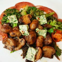 Golden Garlic Mushroom with Coriander Butter and Saute Broccoli A picture of Golden Garlic Mushroom with Coriander Butter and Saute Broccoli.