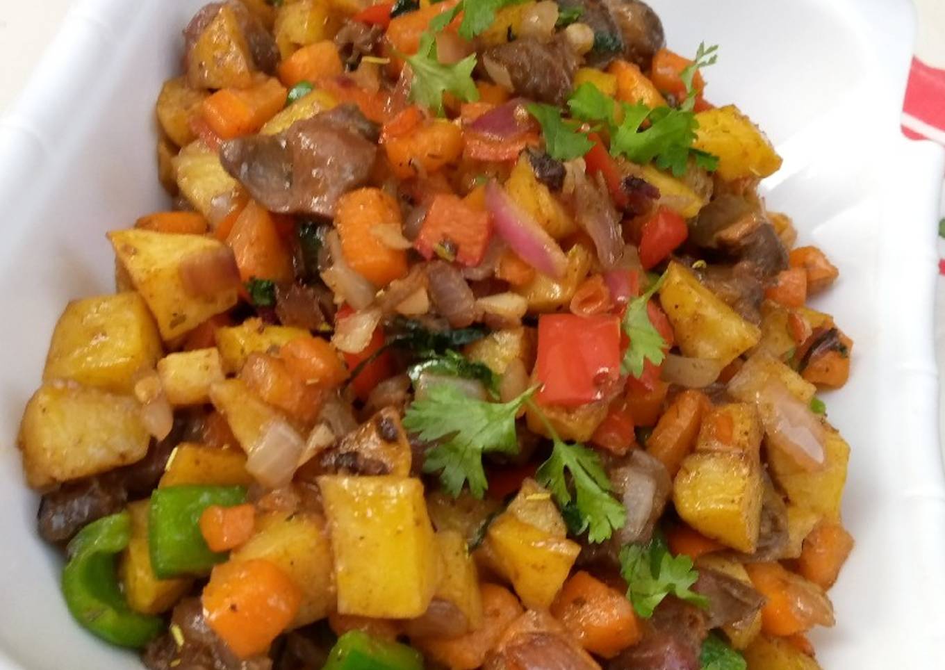 Stir fried potatoes with veggies and gizzard