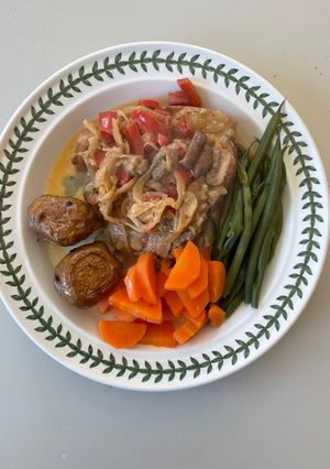 A picture of Pork Chops with creamy cider sauce.