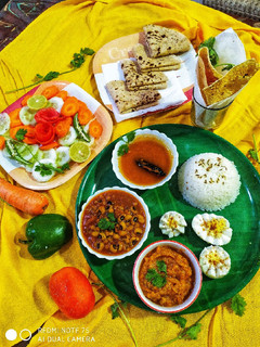 A picture of Rasam and salad.