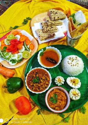 A picture of Rasam and salad.