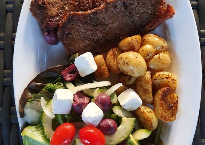 Sirloin Steaks with fried baby potatoes & a greek salad