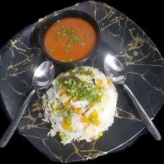A picture of Matar Pulao with Tomato Spicy soup.