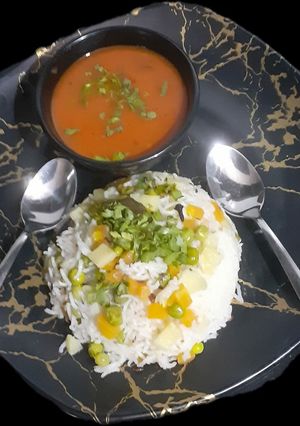 A picture of Matar Pulao with Tomato Spicy soup.