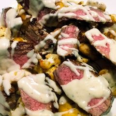 A picture of Beef and cauliflower with creamy parmesan sauce.