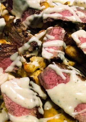 A picture of Beef and cauliflower with creamy parmesan sauce.