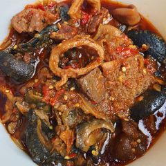 Ofada stew with snail A picture of Ofada stew with snail.