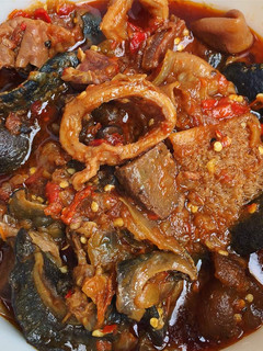 A picture of Ofada stew with snail.