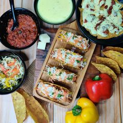 A picture of Baked Tacos and Nachos.