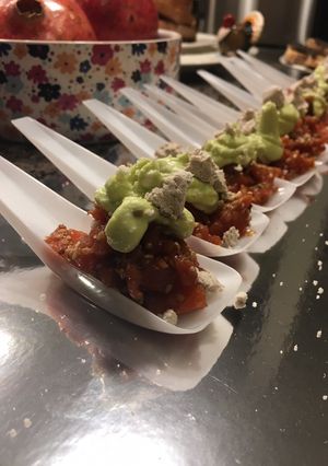 A picture of King Salmon Asian Tartare with avocado cream and olive oil powder.