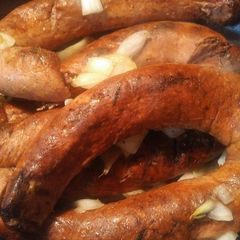 A picture of Grilled Sausage and grilled onions.