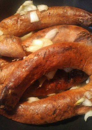 A picture of Grilled Sausage and grilled onions.