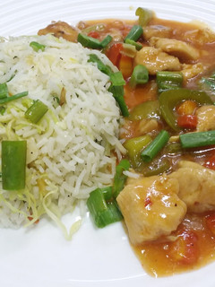 A picture of Chicken Manchurian with Fried Rice.