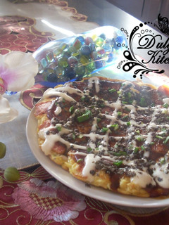 Una foto de Okonomiyaki - Pizza japonesa -