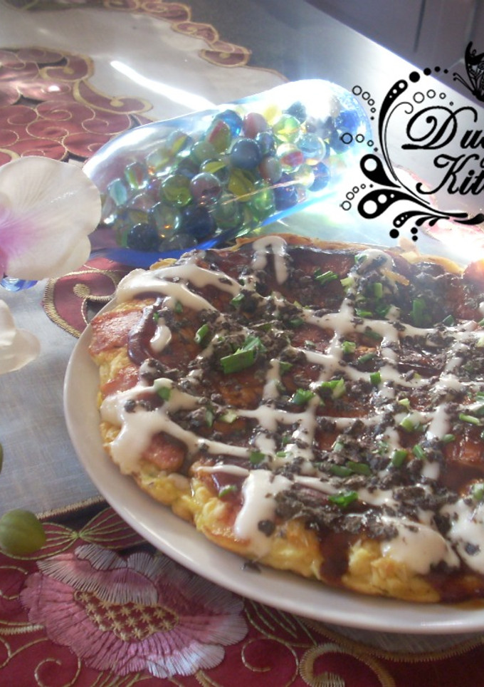 Una foto de Okonomiyaki - Pizza japonesa -