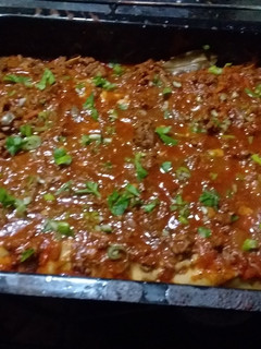 Una foto de Canelones de acelga con salsa blanca y roja