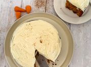A picture of carrot cake with cream cheese frosting