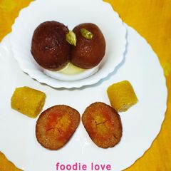 Stuffed Moong dal halwa Jamun with carrot and mango puree A picture of Stuffed Moong dal halwa Jamun with carrot and mango puree.