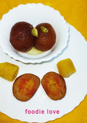 A picture of Stuffed Moong dal halwa Jamun with carrot and mango puree.