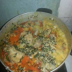 A picture of Egusi Soup with Assorted Meat And stock Fish.