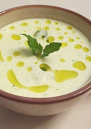 A picture of Cucumber Gazpacho with Pistachios, Plain Yogurt, and Mint.