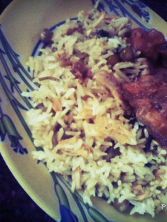 A picture of Pulao with Curshed Chicken & Peas.
