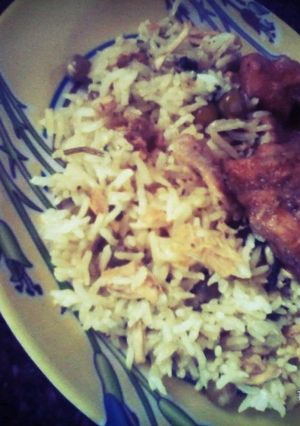 A picture of Pulao with Curshed Chicken & Peas.