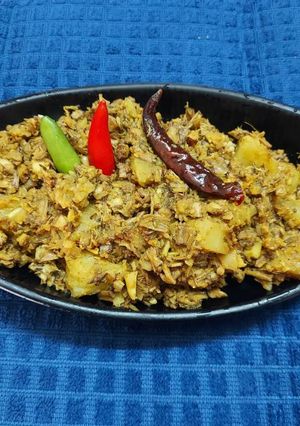 A picture of Banana Flower Dry Curry or Mochar Ghonto.