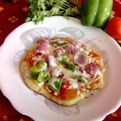 Pizza uttapam A picture of Pizza uttapam.