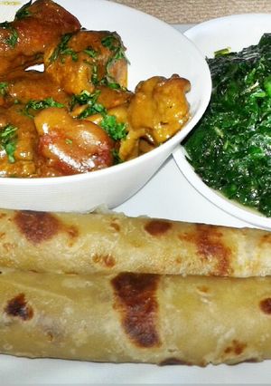 A picture of Coconut chicken and soft layerd chapati.