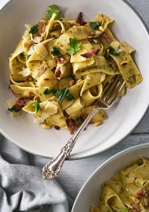 A picture of Wild Garlic Pesto Pappardelle With Crispy Bacon & Pine Nuts.