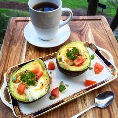 A picture of Roasted avocado and eggs.
