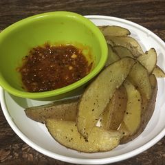 Baked Potato Wedges With Spicy Sauce A picture of Baked Potato Wedges With Spicy Sauce.
