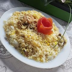 A picture of Smoked Chicken Tikka Biryani.