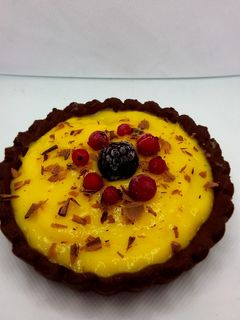 Una foto de Tartaletas de chocolate con crema de naranja