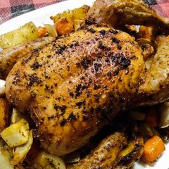A picture of One tray roast whole chicken, potatoes and veg.