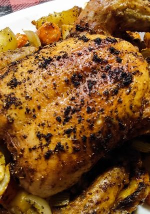 A picture of One tray roast whole chicken, potatoes and veg.