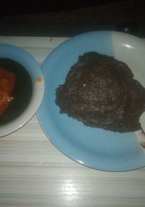 A picture of Yam flour (AMala) and ewedu with stew.