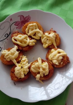 Una foto de Huevos hervidos empanados