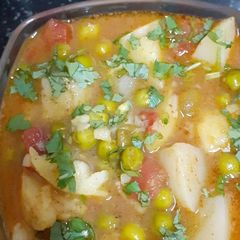 A picture of Aloo - matar subji | potato - green peas vegetable.