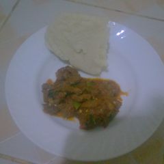 A picture of Wet beef fry and ugali.