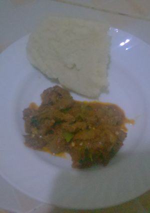 A picture of Wet beef fry and ugali.