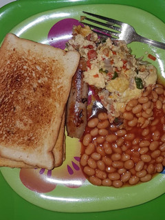 A picture of Toast with sausage & omelette.