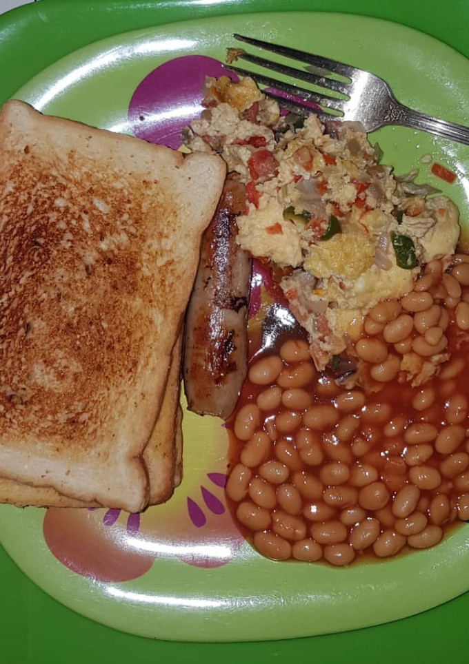 A picture of Toast with sausage & omelette.