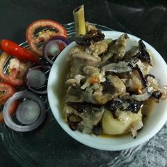 A picture of Steamed chicken with veggies.