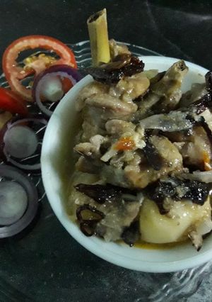 A picture of Steamed chicken with veggies.