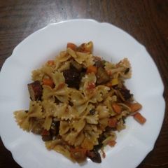 A picture of Veggetable and beef sausages with pasta.