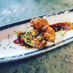 A picture of Crispy Cauliflower chevre cheese sauce glaze with sweet ponzu.