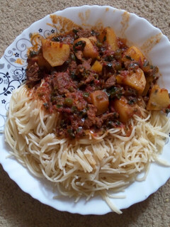 A picture of Spaghetti and beef stew.