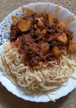 A picture of Spaghetti and beef stew.